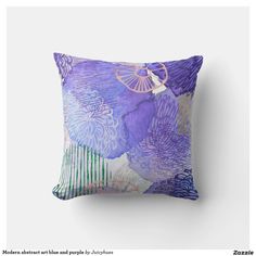 a purple and green pillow on a white wall with an image of flowers in the background