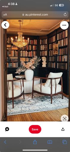 an image of a living room with furniture and bookshelves on the wall,