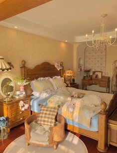 a bedroom with a bed, chair and chandelier hanging from the ceiling in front of a mirror