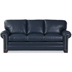 a blue leather couch with nail polishing on the armrests and back cushions