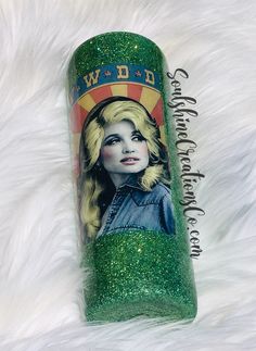 a green glittered canister with a picture of dolly monroe on the top and bottom