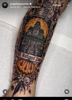 a person with a halloween themed tattoo on their leg