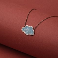 Step into the ethereal beauty of our sky-inspired Blue Enamel Cloud Pendant Necklace. Exquisitely crafted from 14K gold and coated with a mesmerizing blue enamel finish, this piece echoes the tranquil hues of a summer sky. Its minimalist design makes it a perfect accessory for any outfit, subtly accentuating your style with a delicate charm.  🌟 Key Features: 🦋 Handcrafted butterfly pendant exuding unmatched artisanal finesse. ☁️ Authentic blue enamel cloud pendant, a symbol of serenity and calm. 💛 18K solid gold chain and pendant for an opulent touch. 👌 Lightweight, durable, and comfortable to wear daily. 🎁 The perfect gift for her on any special occasion like Birthdays or Christmas. ✨ Beautifully packaged for a luxurious gift-giving experience. Whether you're a minimalist fashion lov Celestial Turquoise Necklaces As Gift, Celestial Turquoise Necklaces For Gifts, Turquoise Celestial Necklaces As Gift, Celestial Turquoise Necklace For Gift, Turquoise Celestial Style Necklace For Gift, Cloud Necklace, Cloud Pendant, Christmas Necklace, Necklace Cute