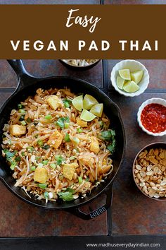 an easy vegan pad thai recipe in a cast iron skillet with ingredients on the side