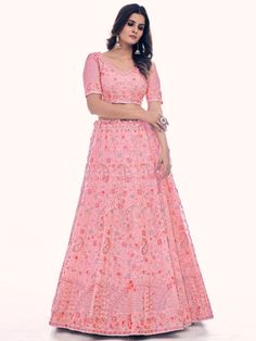 Buy radiant pink net embroidered lehenga choli for celebrating upcoming festival celebration. Shop this classy lehenga choli which comes with Net blouse and Net dupatta.