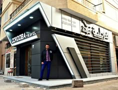 a man standing in front of a building