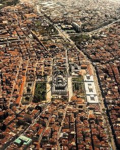 an aerial view of a city with lots of buildings