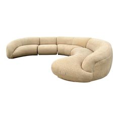 the curved couch is made out of beige fabric