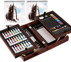 a wooden box with two sets of watercolors and art supplies in it on a white background