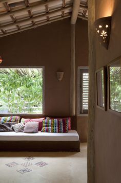 a living room with a couch and windows