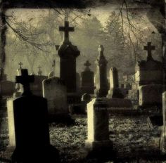 an old cemetery with many headstones and crosses