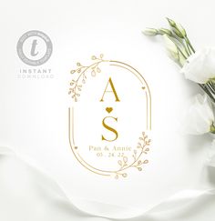 white flowers are sitting on top of a paper with the letter s in gold foil