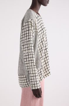 The Belgian design house known for its innovative prints goes meta geometrical with a grid rendered in two scales patterning this asymmetric stretch-silk top. Ballet neck Long sleeves Dropped shoulders High-low hem 94% silk, 6% elastane Dry clean Made in Bulgaria Designer Clothing Belgian Design, Grid Print, Fabric Gift Bags, Dries Van Noten, Fabric Gifts, Free Fabric, Anniversary Sale, High Low Hem, Design House