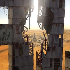 an image of a sci - fi scene taken from the top of a building in the desert