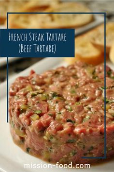 french steak tartare beef tartare on a plate with bread in the background