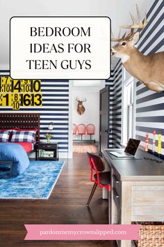 a bedroom with blue and white striped wallpaper, wooden flooring and deer head mounted above the bed