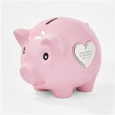 a pink piggy bank with a heart on it