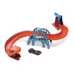 an orange and blue toy train set with cars on it's tracks that are shaped like a dragon