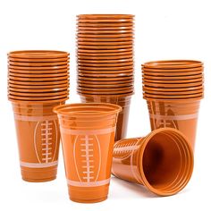 orange plastic cups with football designs on them