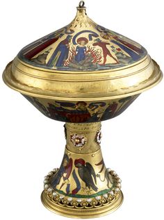 an ornately decorated golden bowl with angels on it