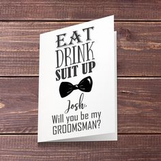 a card with the words eat drink suit up and a bow tie on it