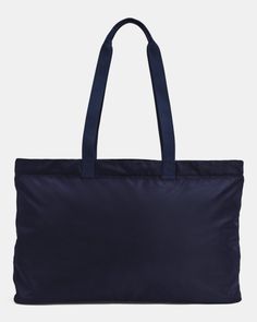 a navy blue tote bag on a white background, with the handles folded down