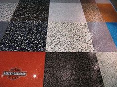 the floor is made up of different colors and patterns, including black, white, red, blue, and grey