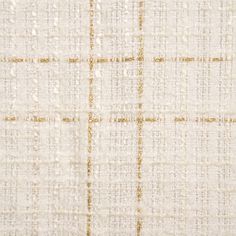 a white and gold textured fabric with small squares