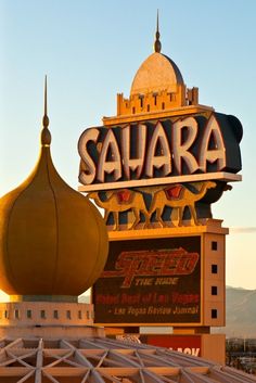 there is a large sign that says sahar on top of a building in the city