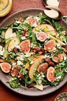 a salad with figs, nuts and feta cheese