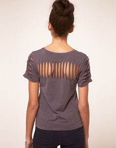 a woman wearing a t - shirt with cutouts on the front and back side