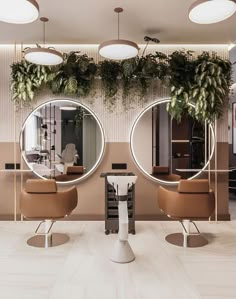 the salon is decorated with mirrors and plants