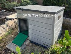 a small dog house with a green door