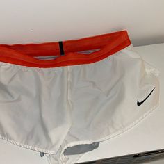 Washed And Maybe Worn Once. Orange Band With Black Strip In Back. White Split Shorts With Built In Liner Orange Training Shorts, Orange Nylon Sports Shorts, Orange Moisture-wicking Athletic Shorts For Sports, Cheap Orange Athletic Shorts With Built-in Liner, Orange Moisture-wicking Gym Shorts, White Nike, Nike Shorts, Shorts Athletic, White Nikes