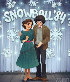 a couple standing next to each other in front of snowflakes on a wall