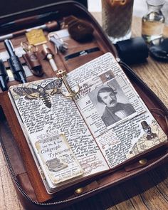 an open book sitting on top of a wooden table