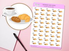 a cup of coffee and some cookies on a plate next to a sticker sheet