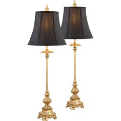 two lamps with black shades on them sitting next to each other in front of a white background