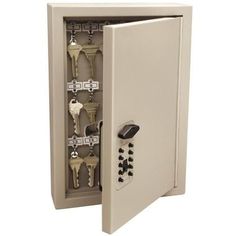 an open safe box with keys in it