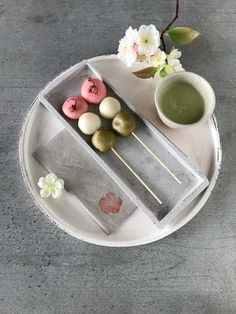 a plate that has some food on it and a cup with saucer next to it