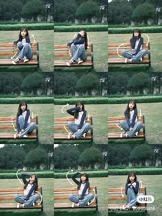 a woman sitting on top of a wooden bench in front of green grass and bushes