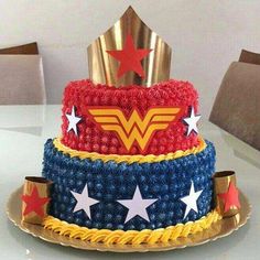 the cake is made to look like wonder woman's hat and stars on it