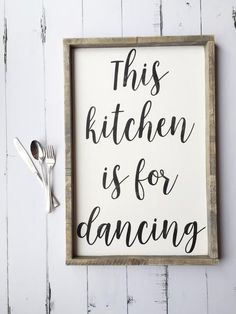 this kitchen is for dancing sign with utensils and spoons next to it