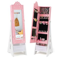 a pink and white doll's dressing table with a mirror