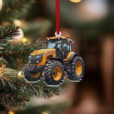 a tractor ornament hanging from a christmas tree