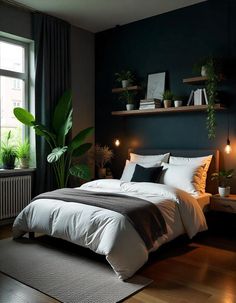 a bedroom with black walls and white bedding, potted plants on the wall