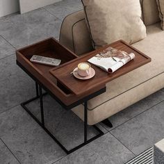 a coffee table with a tray on it next to a couch