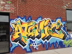 graffiti painted on the side of a brick building