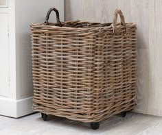 a wicker basket sitting on top of a wooden floor