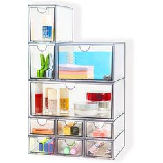 three clear drawers are stacked on top of each other with different items in them,